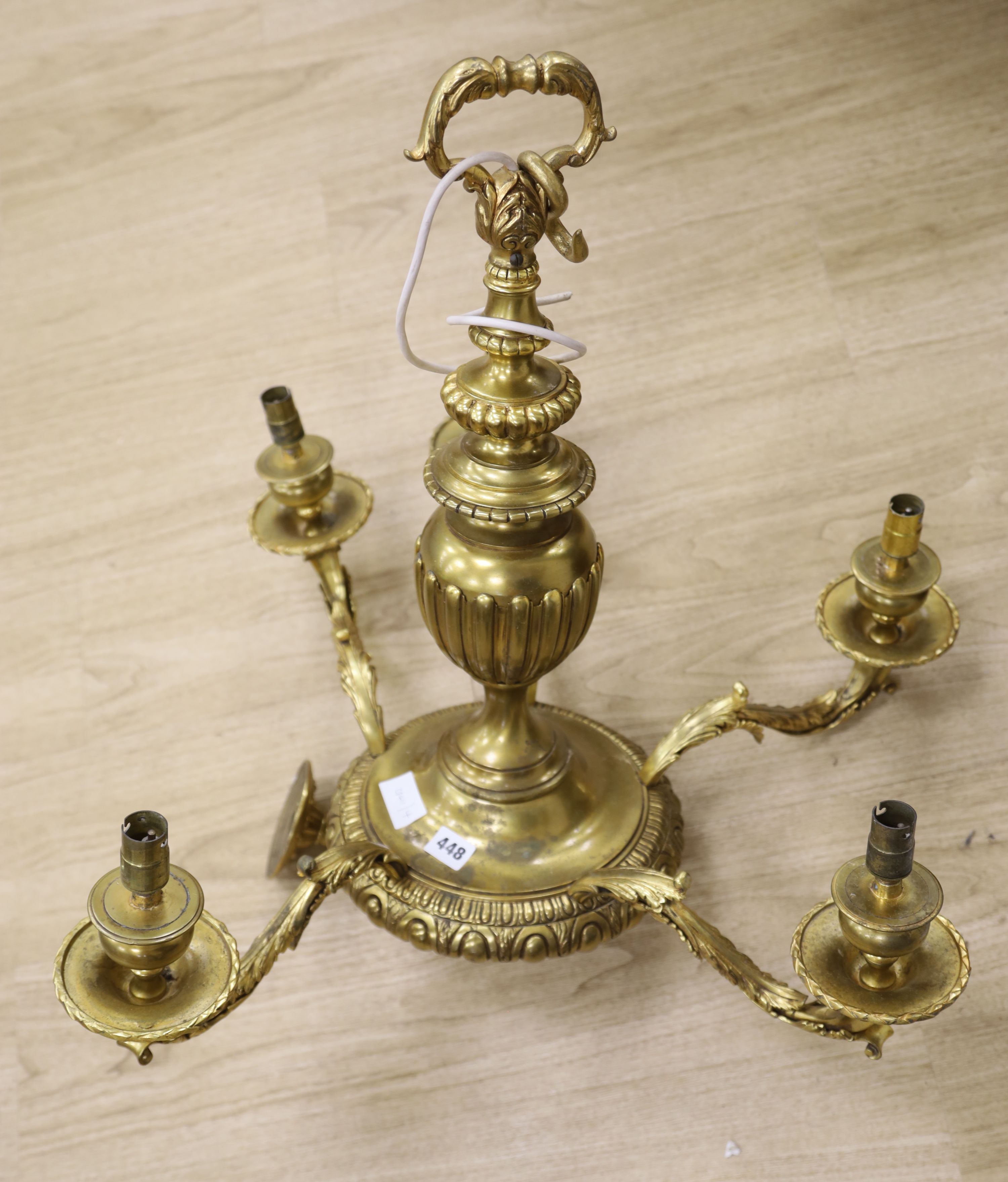A Louis XIV style five branch solid brass chandelier, drop 65cm